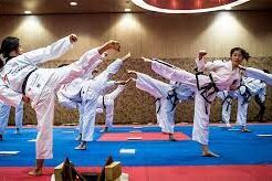 People practicing martial arts in a dojo.